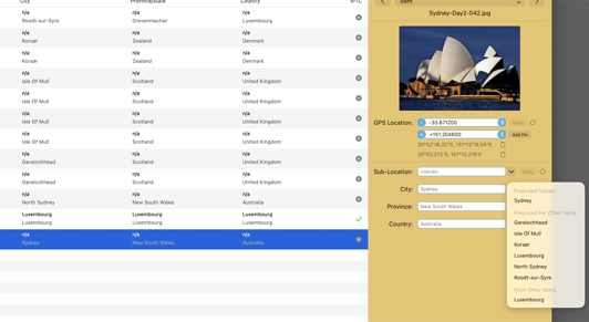 Close-up of the IPTC fields with grey location suggestions next to stored values, and an open pop-up menu listing the proposed value, proposals for other items, and values already used in other photos